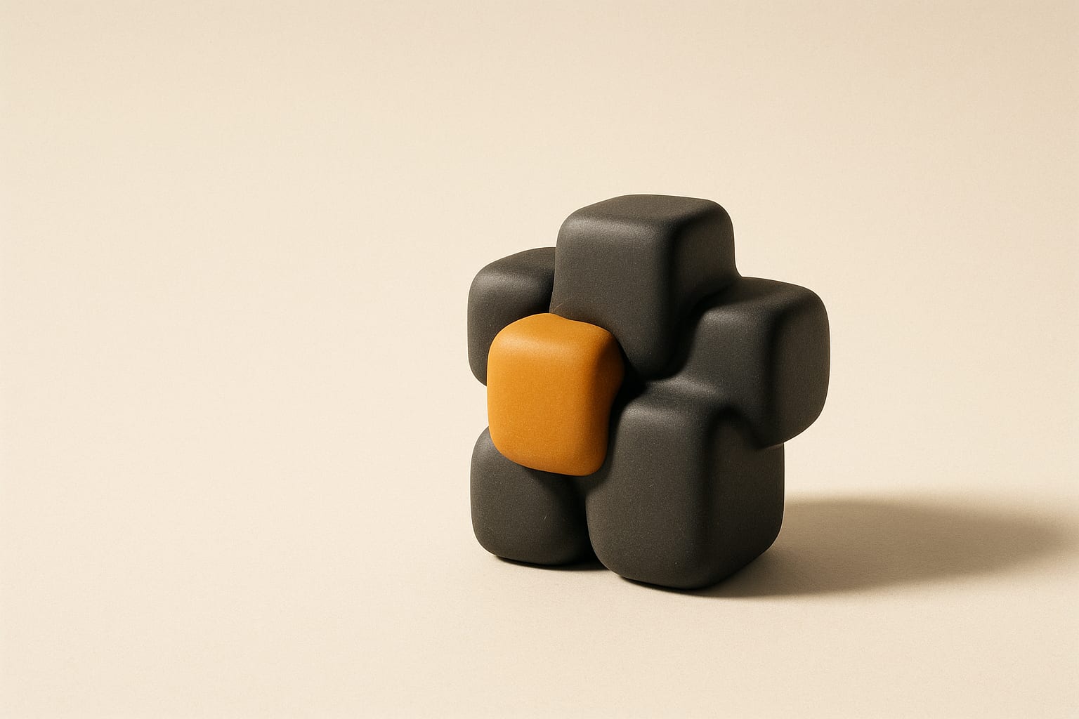 Charcoal blocks fusing into one form, one of them amber